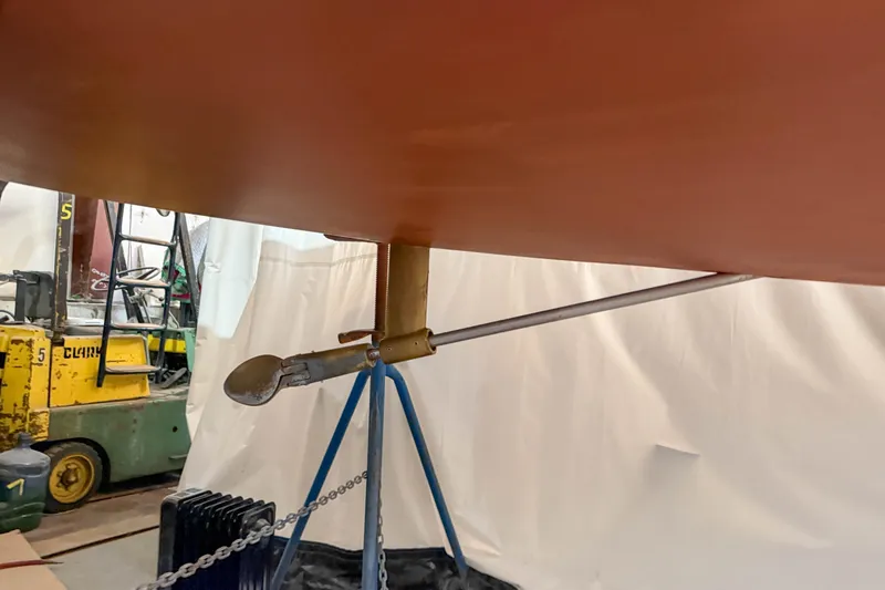 Slide: The Image of Rudder and propeller of a 1997 Alerion Express 28 sailboat in a workshop. - 26