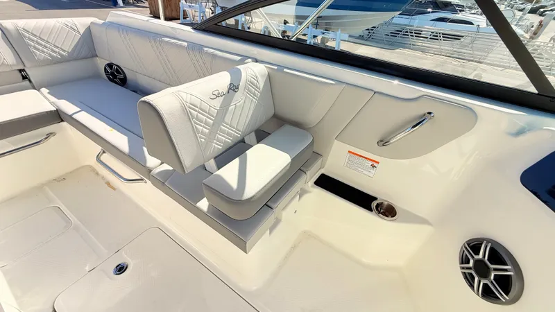 Slide: The Image of Interior of the Sea Ray SDX 250 Outboard with white upholstery and speakers. - 33