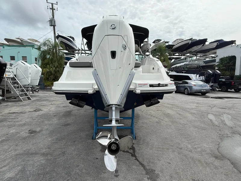 Slide: The Image of A 2026 Sea Ray SDX 250 Outboard is on a stand in a marina area. - 5