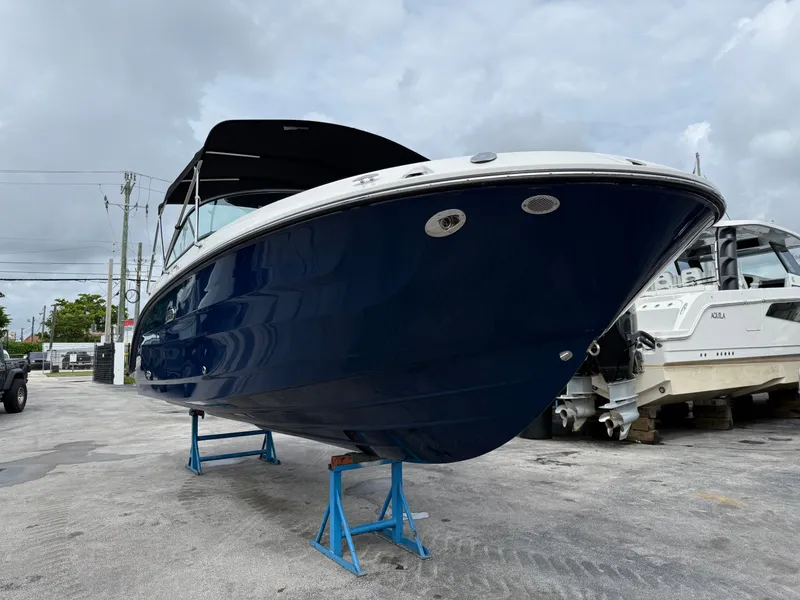 Slide: The Image of Sea Ray SDX 250 Outboard 2026 on stands outdoors. - 3