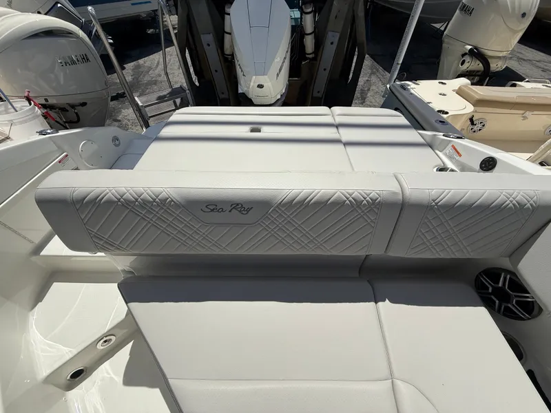 Slide: The Image of The image shows the white upholstery of a 2026 Sea Ray SDX 250 Outboard. - 16