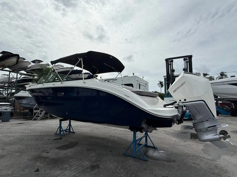 Slide: The Image of A 2026 Sea Ray SDX 250 Outboard on stands, featuring a large outboard motor. - 6