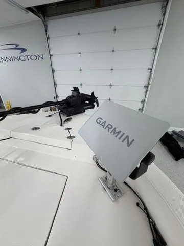 Slide: The Image of The image shows the cockpit of a Ranger 2360 Bay boat with a Garmin device. - 7