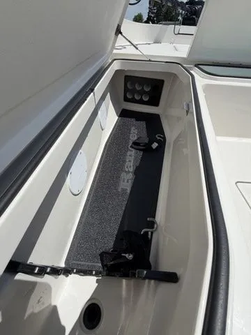 Slide: The Image of Interior view of a Ranger 2360 Bay boat with storage compartment and accessories. - 11