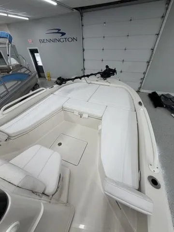 Slide: The Image of The image shows the deck of a 2025 Ranger 2360 Bay boat in a garage. - 9