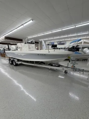 Slide: The Image of A 2025 Ranger 2360 Bay boat on a trailer in a showroom. - 31