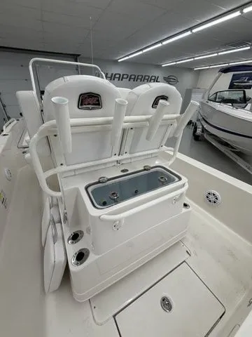Slide: The Image of The image shows the stern of a Ranger 2360 Bay boat with rod holders and a livewell. - 16