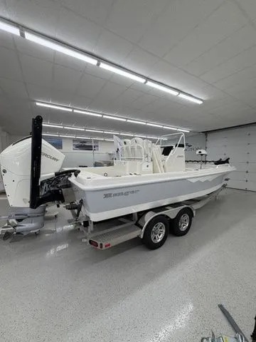 Slide: The Image of A 2025 Ranger 2360 Bay boat on a trailer in a garage. - 32