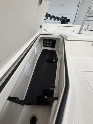 Slide: The Image of Interior view of a Ranger 2360 Bay boat with storage and controls. - 28