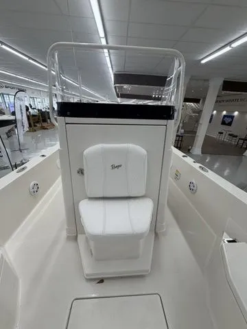 Slide: The Image of The image shows the cockpit of a Ranger 2360 Bay boat with a white seat. - 29