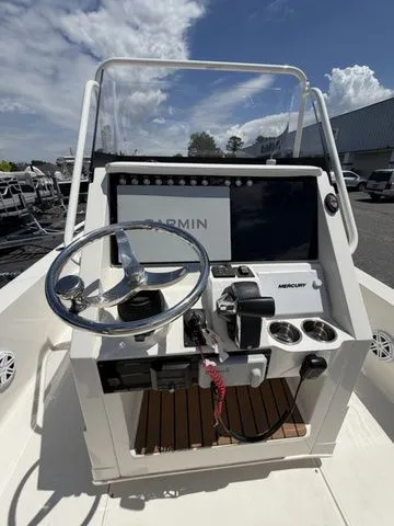 Slide: The Image of The image shows the helm of a 2025 Ranger 2360 Bay boat with a Garmin display. - 18
