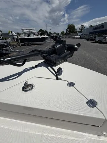 Slide: The Image of The image shows the deck of a Ranger 2360 Bay boat with a motor and clear sky. - 6