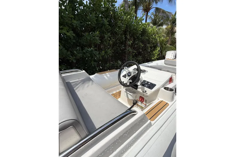 Slide: The Image of 2022 AB Inflatables ABJET 430XP boat interior with steering wheel and seating. - 17