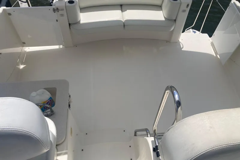 Slide: The Image of 2002 Silverton 39 Motor Yacht deck with seating and railing, featuring a clean, spacious layout. - 8