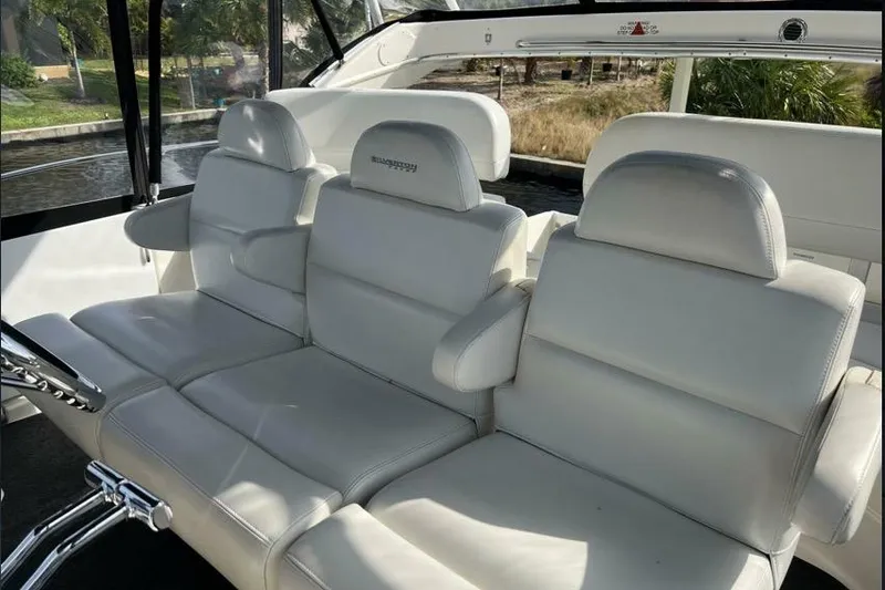 Slide: The Image of Luxurious white seating on a 2002 Silverton 39 Motor Yacht, showcasing comfort and style. - 6