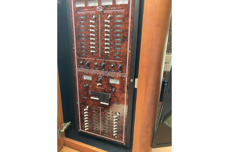 Slide: The Image of Electrical control panel on a 2002 Silverton 39 Motor Yacht, featuring battery and AC controls. - 26