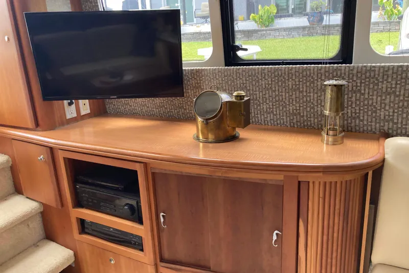 Slide: The Image of Interior of 2002 Silverton 39 Motor Yacht with TV and nautical decor. - 17