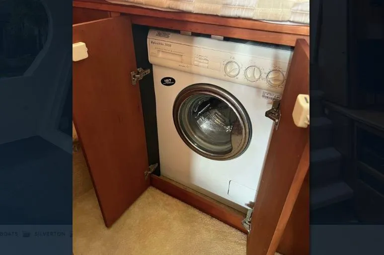 Slide: The Image of Washing machine inside a 2002 Silverton 39 Motor Yacht cabinet. - 27