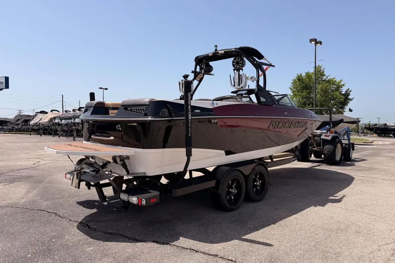 Slide: The Image of 2019 Moomba Makai boat on trailer in parking lot under clear sky. - 6