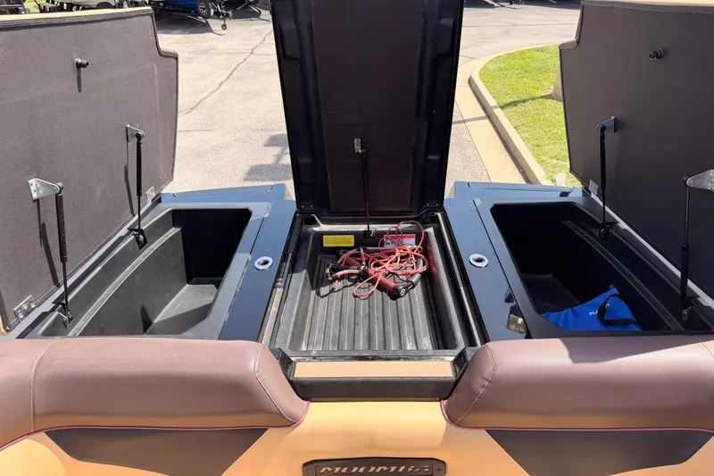 Slide: The Image of 2019 Moomba Makai boat storage compartments open, revealing interior space and equipment. - 28
