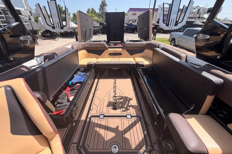 Slide: The Image of 2019 Moomba Makai boat interior with spacious seating and storage compartments. - 36