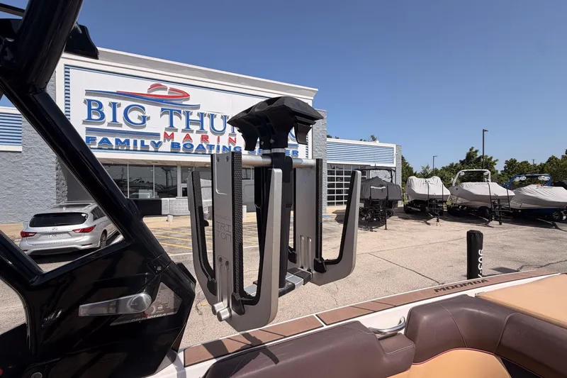 Slide: The Image of 2019 Moomba Makai boat at Big Thunder Marine dealership, with covered boats in the background. - 25
