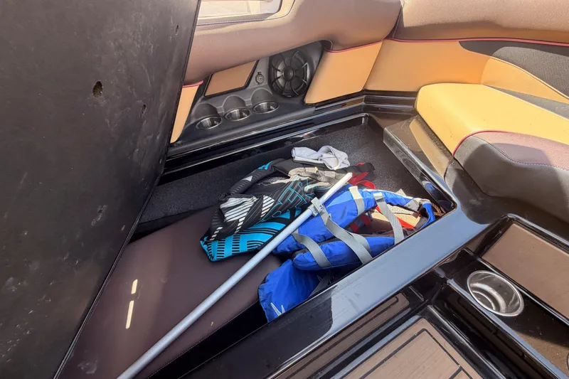 Slide: The Image of 2019 Moomba Makai boat interior storage with life jackets and equipment. - 11