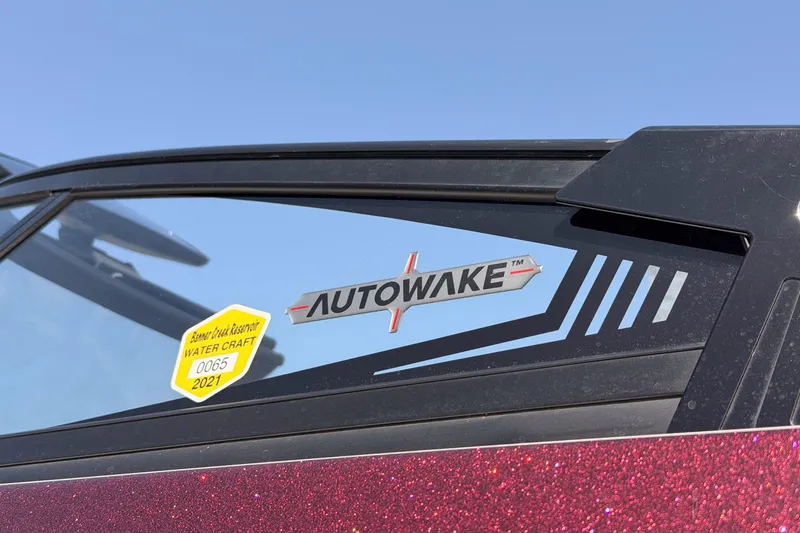 Slide: The Image of 2019 Moomba Makai boat with Autowake sticker and watercraft permit. - 4