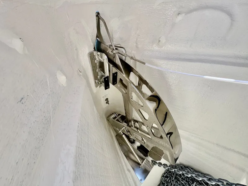 Slide: The Image of A shiny anchor is stored in a white compartment of the Saxdor 320 GTC boat. - 47