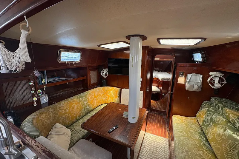 Slide: The Image of Interior of 1980 Gulfstar 50 CC Ketch with cozy seating and wooden finishes. - 40