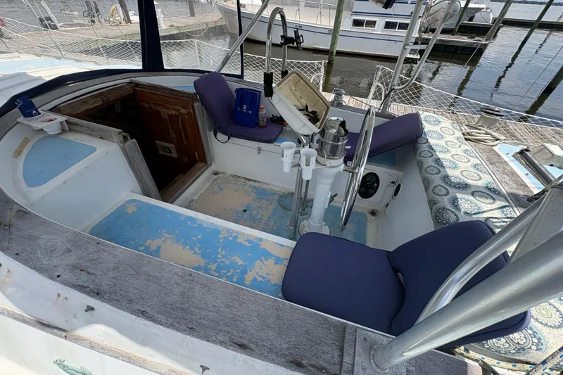 Slide: The Image of Cockpit of 1980 Gulfstar 50 CC Ketch with blue cushions and nautical decor. - 11