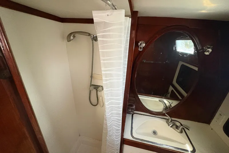 Slide: The Image of Bathroom interior of 1980 Gulfstar 50 CC Ketch with shower and oval mirror. - 46