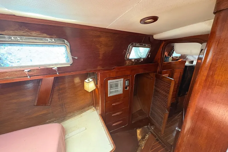 Slide: The Image of Interior of 1980 Gulfstar 50 CC Ketch with wooden paneling and cozy cabin space. - 35