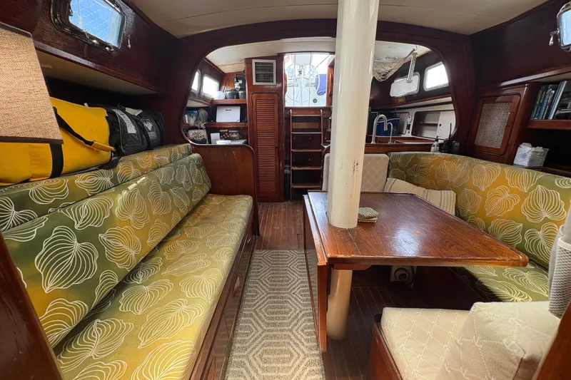 Slide: The Image of Interior of 1980 Gulfstar 50 CC Ketch sailboat with cozy seating and wooden table. - 17