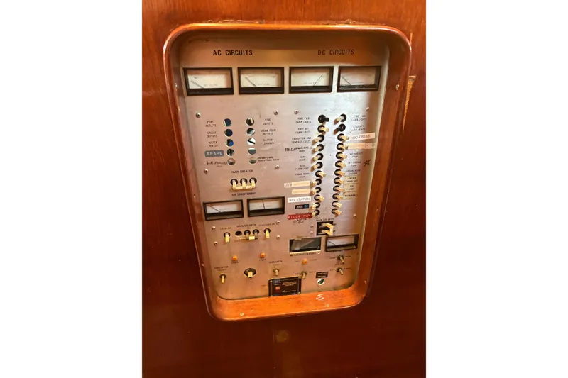 Slide: The Image of Electrical panel of a 1980 Gulfstar 50 CC Ketch sailboat, featuring AC and DC circuits. - 29