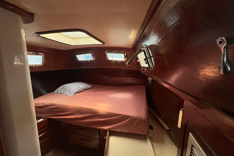Slide: The Image of Cozy cabin interior of 1980 Gulfstar 50 CC Ketch with wooden finish and skylight. - 30