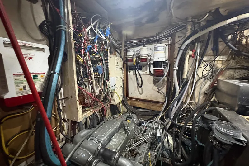 Slide: The Image of Engine room of a 1980 Gulfstar 50 CC Ketch with wiring and machinery. - 50