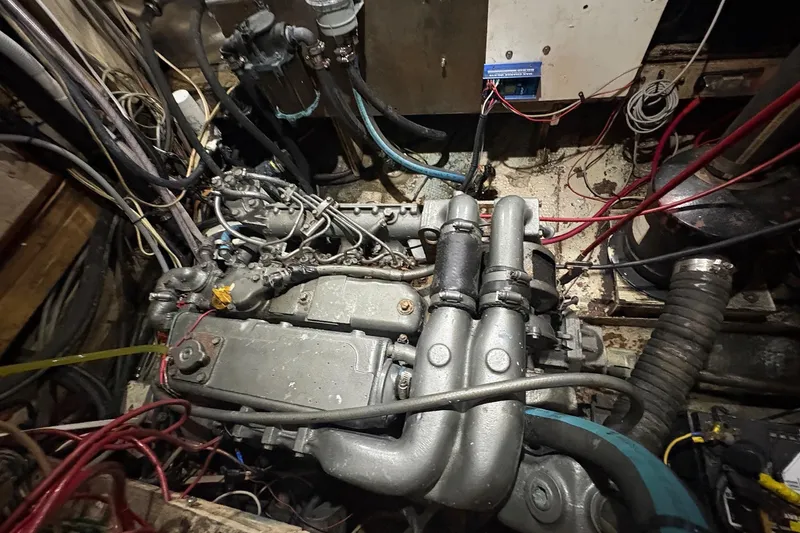 Slide: The Image of Engine compartment of a 1980 Gulfstar 50 CC Ketch, showing complex wiring and components. - 51
