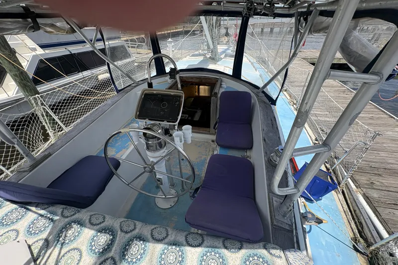 Slide: The Image of Cockpit of 1980 Gulfstar 50 CC Ketch with steering wheel and navigation equipment. - 12