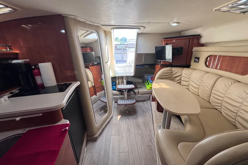 Slide: The Image of Interior of 2003 Rinker Fiesta Vee 312 boat with cozy seating and modern amenities. - 20