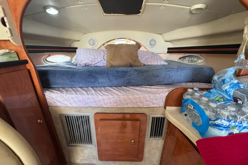 Slide: The Image of Interior cabin of 2003 Rinker Fiesta Vee 312 with bed and storage. - 18