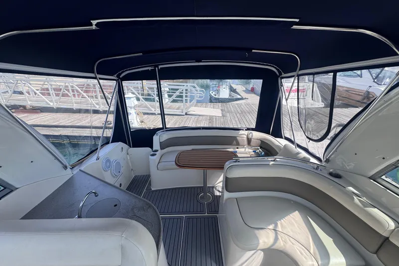 Slide: The Image of Interior of 2003 Rinker Fiesta Vee 312 boat with seating and table. - 14
