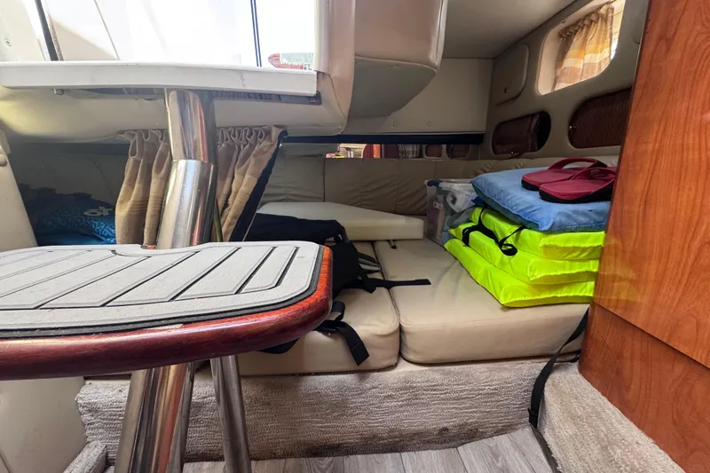 Slide: The Image of Interior cabin of 2003 Rinker Fiesta Vee 312 boat with seating and storage. - 22