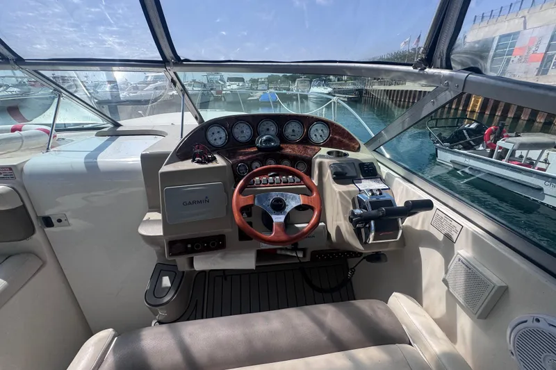 Slide: The Image of Cockpit view of 2003 Rinker Fiesta Vee 312 boat with Garmin navigation system. - 9