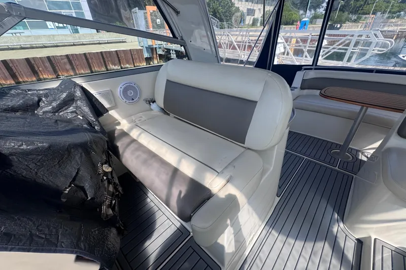 Slide: The Image of Interior of 2003 Rinker Fiesta Vee 312 boat with seating and table. - 10