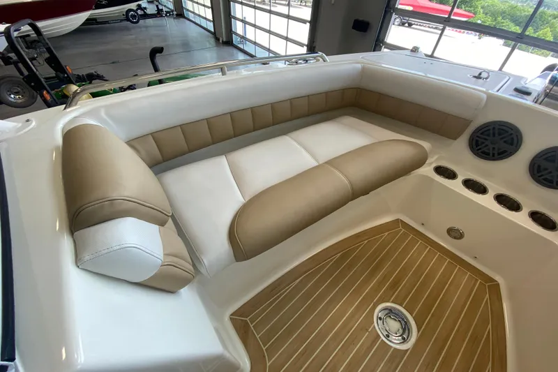 Slide: The Image of 2016 World Cat Glacier Bay Edition 2740 Dual Console interior with tan and white seating. - 53