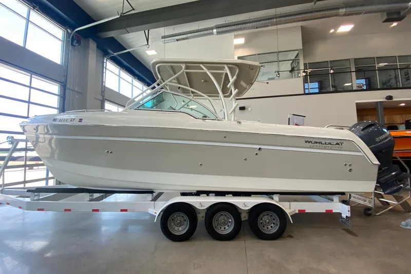 Slide: The Image of 2016 World Cat Glacier Bay Edition 2740 Dual Console boat on trailer in showroom. - 25