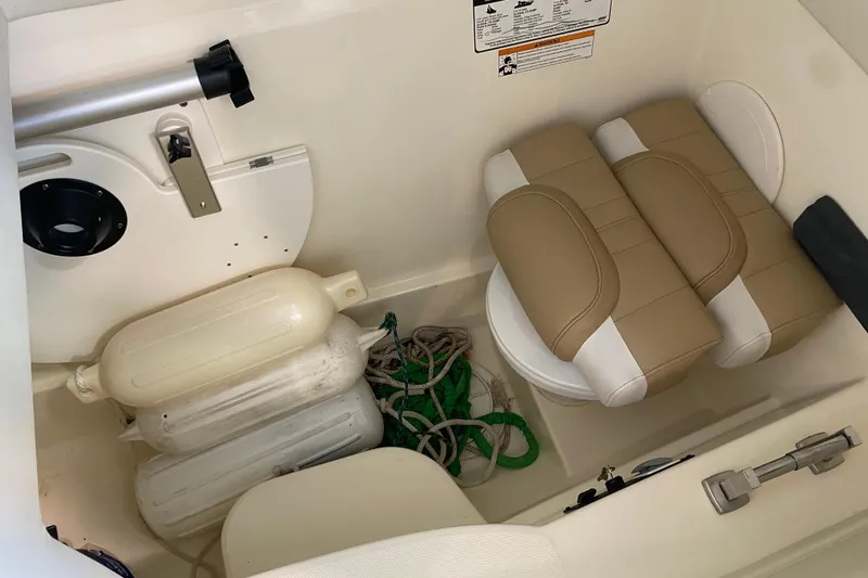 Slide: The Image of Storage compartment in a 2016 World Cat Glacier Bay Edition 2740 Dual Console boat. - 39