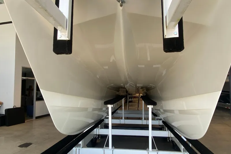 Slide: The Image of 2016 World Cat Glacier Bay Edition 2740 Dual Console boat hull in storage facility. - 24