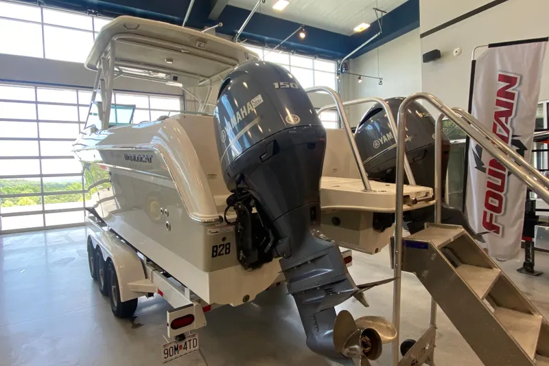 Slide: The Image of 2016 World Cat Glacier Bay Edition 2740 Dual Console with Yamaha engines in showroom. - 26